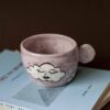 handmade ceramic mug with clouds and faces. an amazing perfect mug with celestial creatures perfect for capuccino and tea. Μια πανέμορφη χειροποίητη κούπα με συννεφάκια με πρόσωπα. Κατάλληλη για καπουτσίνο και τσάι.