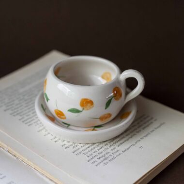 cute ceramic handmade cup with a saucer and fruits. Lemons, cherries and tangerines. perfect for espresso and single turkish coffee. Γλυκά χειροποίητα κεραμικά κουπάκια με πιατάκι και φρουτάκια. Κατάλληλη για εσπρέσο και μονό ελληνικό καφέ.