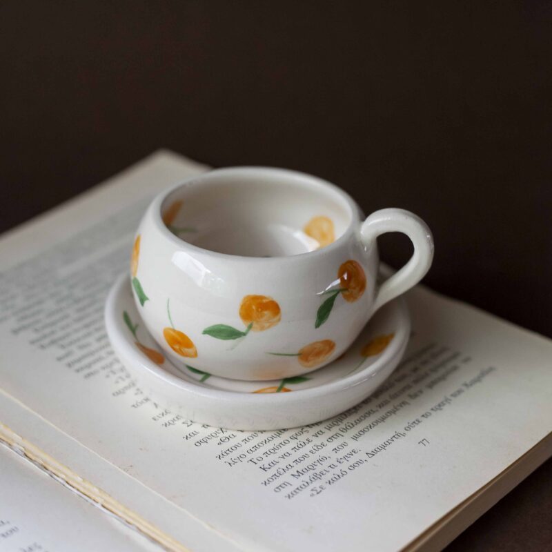 cute ceramic handmade cup with a saucer and fruits. Lemons, cherries and tangerines. perfect for espresso and single turkish coffee. Γλυκά χειροποίητα κεραμικά κουπάκια με πιατάκι και φρουτάκια. Κατάλληλη για εσπρέσο και μονό ελληνικό καφέ.