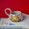 round mug with calcifer from howls moving castle. χειροποίητη κούπα με πηλό υψηλής θερμοκρασίασ και τον αγαπημένο μας calcifer απο το κινούμενο κάστρο.