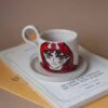 handmade ceramic cup with a saucer with Ashitaka on from princess Mononoke. χειροποίητη κεραμική κούπα με πηλό υψηλής θερμοκρασίας και πιατάκι. ζωγραφισμένος πάνω ο Ασιτάκα από την πριγκίπισσα Μονονόκε.