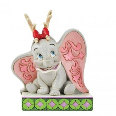 “Disney Traditions figurine of Dumbo wearing festive reindeer antlers, hand-painted with Jim Shore folk-art patterns.”