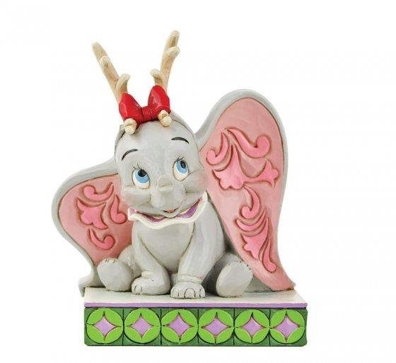 “Disney Traditions figurine of Dumbo wearing festive reindeer antlers, hand-painted with Jim Shore folk-art patterns.”