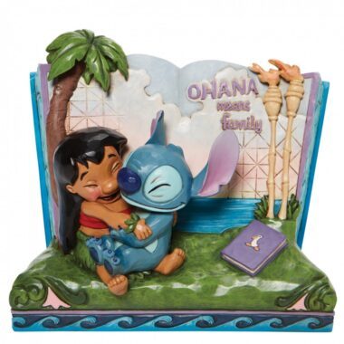 Bring home the magic of Disney with the Disney Showcase Storybook Lilo and Stitch “ʻOhana Means Family” by Jim Shore. Perfect for Disney collectors, Lilo & Stitch fans, and lovers of hand-painted figurines, this high-quality cast-stone sculpture captures the heartwarming bond between Lilo and Stitch. Featuring Jim Shore’s signature folk-art style and detailed craftsmanship, this collectible figurine makes an ideal gift for anniversaries, Disney displays, or home décor. Shop now for authentic Disney Showcase pieces that celebrate the meaning of family.