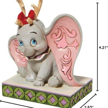 Bring festive charm to your collection with the Disney Traditions Dumbo with Reindeer Antlers Figurine by Jim Shore. This hand-crafted collectible features Dumbo in a joyful Christmas pose, decorated with signature folk-art patterns and detailed hand-painting. Perfect for Disney collectors, holiday décor lovers, and fans of Jim Shore figurines, this high-quality resin sculpture adds warmth and holiday cheer to any display. Shop authentic Disney Traditions holiday figurines for timeless festive magic.