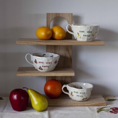 beautiful handmade mugs with the legendary quote give less fucks and fruits on it and inside. όμορφες χειροποίητες κούπες με τη φράση πάνω νοιάξου λιγότερο και διάφορα ζωγραφισμένα φρούτα μέσα και πάνω