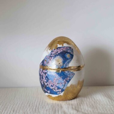 Decorative egg with starry night and almond blossoms with gold leaf