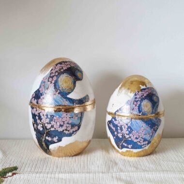 Decorative egg with starry night and almond blossoms with gold leaf
