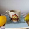 Handmade ceramic mugs with Calcifer design, beige speckled clay, small and large sizes, hand-painted fire character Χειροποίητες κεραμικές κούπες με τον Calcifer, μπεζ πηλός με σαμότ, μικρά και μεγάλο μέγεθος
