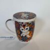 porcelain mug with white kitty and flowers. also a strainer and lid. Κούπα από πορσελάνη με λευκή γατούλα και λουλούδια. έχει καπάκι και σουρωτήρι