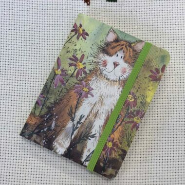 small notebook with orange kitty μικρό σημειοματάριο με πορτοκαλί γατούλα.