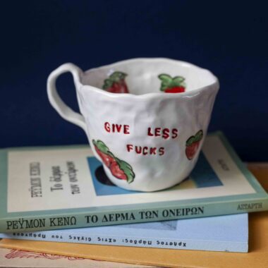 handmade ceramic mug with painted strawberries that writes give less fucks χειροποίητη κεραμική κούπα με φράουλες που γράφει give less fucks