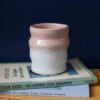handmade cup without handle with pink and white glaze. χειροποίητη κεραμική κούπα με λευκό και ροζ γυαλί.