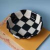 handmade ceramic plate with chessboard pattern. χειροποίητο κεραμικό πιάτο με σχέδιο σκακιέρας.