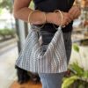 handmade blue bag with two hoop handle . χειροποίητο τσαντάκι με ρίγες σε μπλε αποχρώσεις και δύο μεταλλικούς κρίκους σαν χερούλι.