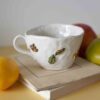 handmade ceramic mug with 3d leaves that writes inside fuck it. χειροποίητη κεραμική κούπα με 3ντι φύλλα που μεσα γραφει παράτα το. μεγάλη κούπα για καφέ και τσάι.