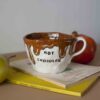 handmade ceramic big mug for hot chocolate. it writes hot chocolate and it has melted chocolate painted. χειροποίητη κεραμική κούπα που είναι για ζεστή σοκολάτα. κατάλληλη για ζεστή σοκολάτα που το γράφει πάνω και έχει λιωμένη σοκολάτα που τρέχει.