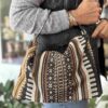 handmade bag with two metallic hoops and pattern that looks like carpet χειροποίητη τσάντα με χερούλια δύο μεταλλικούς κρίκους και μοτίβο που θυμίζει χαλί